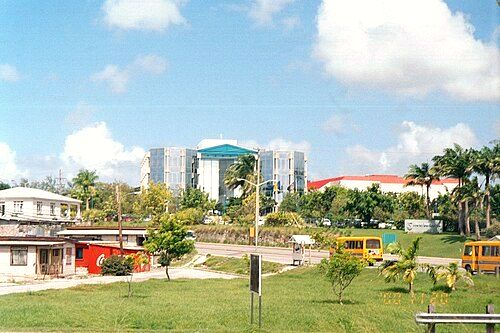 The two 1997 Hino ACME minibuses on the ABC Highway close to the Garfield Sobers Roundabout (sponsored by the then Mutual Life of Barbados; now Sagicor) on 20 November 2000.
