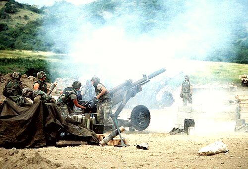 M102 howitzers of 320th Field Artillery Regiment firing during the 1983 invasion of Grenada.