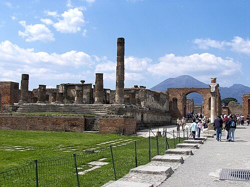 The Forum of Pompeii with Vesuvius in the distance. Pompeii is Italy's third and the world's 48th most visited destination, with over 2.5 million tourists a year.