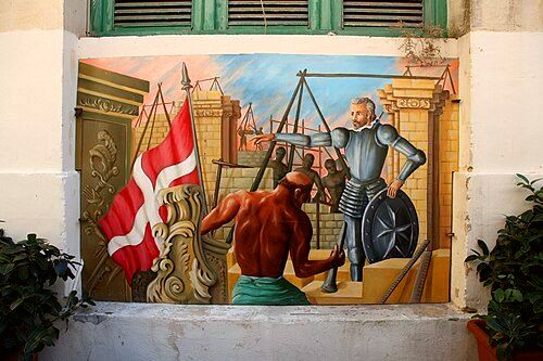 Former mural at Is-Suq tal-Belt illustrating the city's construction