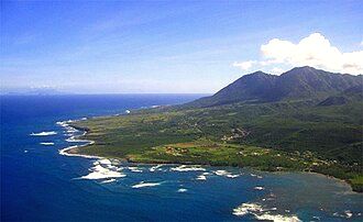 The east coast of Nevis, partially protected by coral reefs with Long Haul Bay visible in the foreground