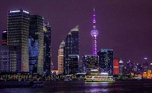 Sightseeing boats ply the river in Shanghai, providing just a tiny percent of the revenue from tourism