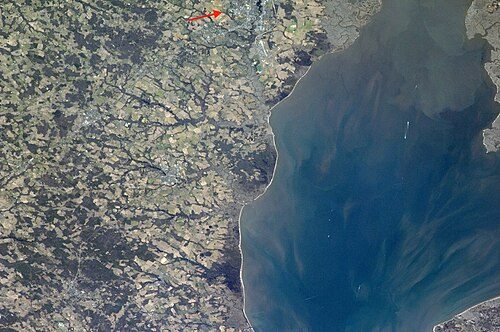 Satellite photo of Dover taken from the International Space Station. The red arrow points at Dover.