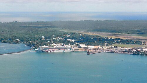 Pride of America docked at Hilo Harbor; Hilo International Airport runway is visible in the background